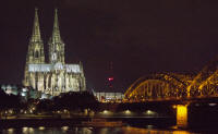 Cologne cathedral and the Hohenzollern Brücke from the east bank of the Rhine, at night