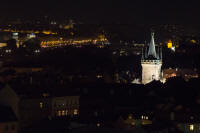 Taller, western bridge tower of Charles Bridge from Prague Castle, at night
