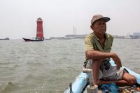 Pilot of the blue tour boat and the red lighthouse