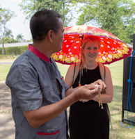 Irwan shows rice offering to Emily Searson