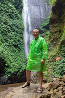 Tourist in fetching green at the Madakaripura Waterfall