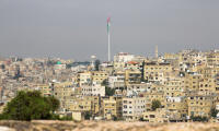 Giant Jordan flag flying over Amman