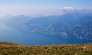 Paragliding with western side of Lake Garda in background