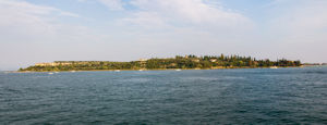 Panorama of Western tip of Sirmione island from the ferry to Garda