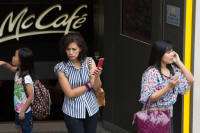 Customers leaving a McCafé