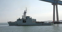 Canadian warship passing under Coronado Bay Bridge