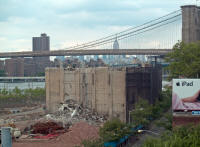 Building under demolition, Brooklyn Bridge and Empire State Building