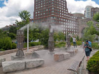 Sculpture emitting fine water spray, in park between John F. Fitzgerald Surface Road and Atlantic Avenue near Broad Street