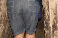 Julie stoops to walk through a tunnel