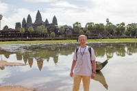 Tourist in front of the temple from the northern lake