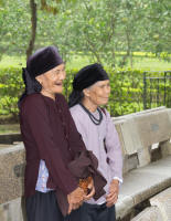 Old women with then-fashionable black teeth