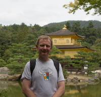 Tourist in front of Kinkaku (The Golden Pavilion)